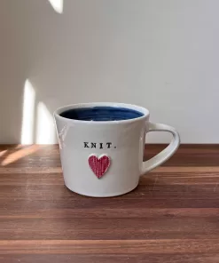 Handmade Pottery Mug with Knit Texture Heart and the word KNIT.