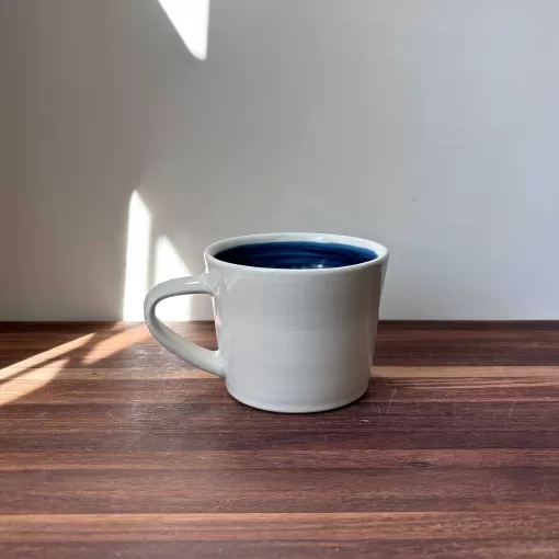 Handmade Pottery Mug with Knit Texture Heart and the word KNIT.